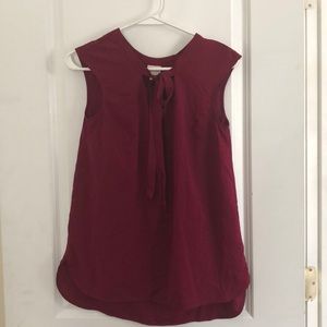 Wine colored sleeveless blouse